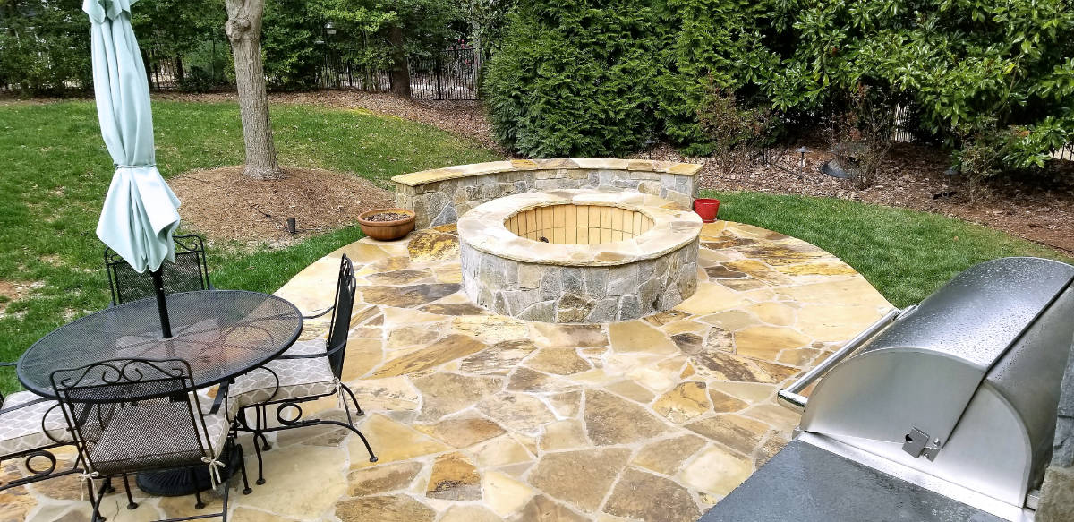 A backyard patio and seating area set up for outdoor entertaining
