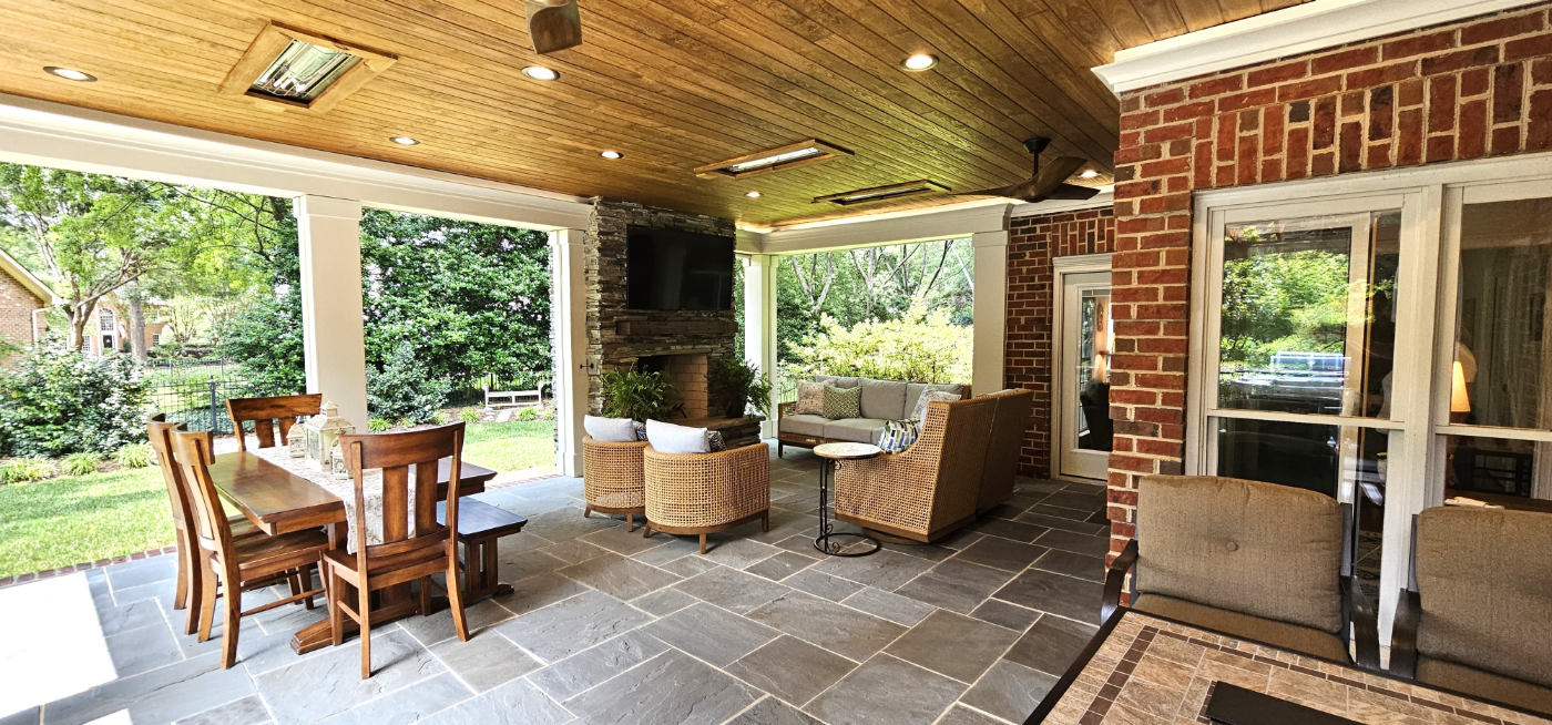 Screened-in covered porch with pergola and open grilling area